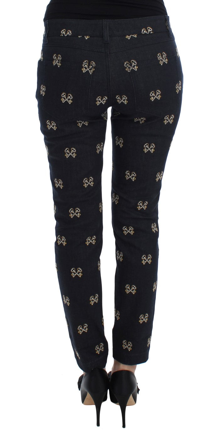 Pair of black pants with gold bee pattern