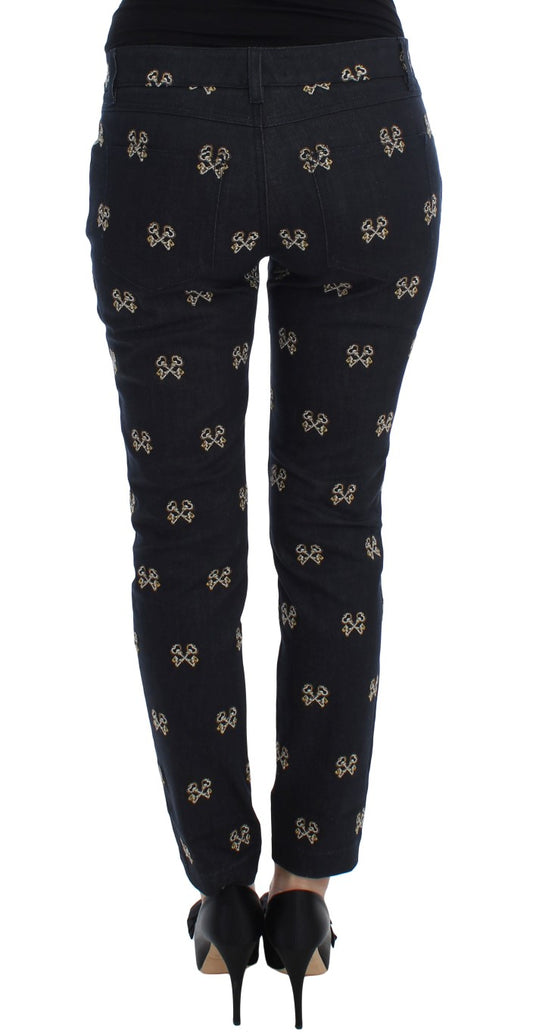 Pair of black pants with gold bee pattern