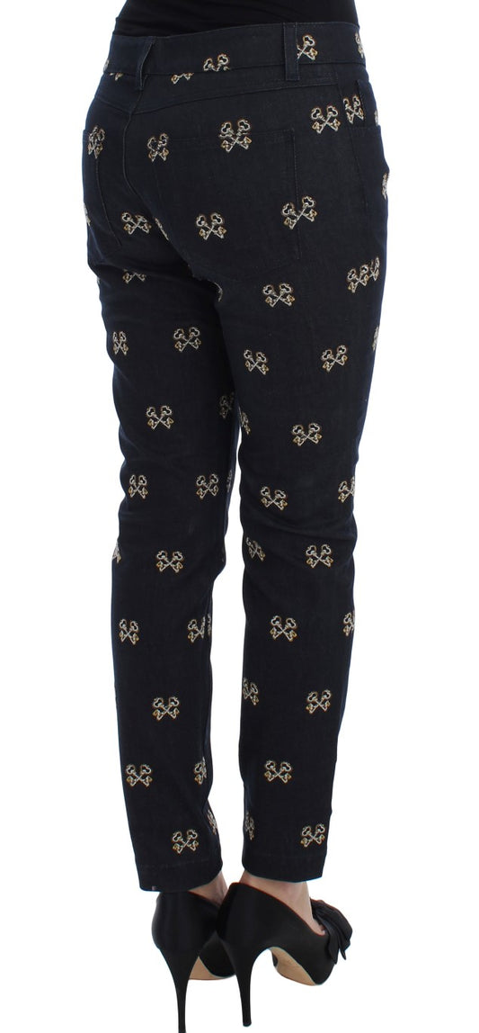 Pair of black jeans with gold floral pattern