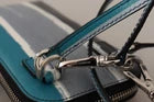 Blue and white striped purse with silver zipper pulls