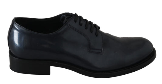 Black leather dress shoe with laces and a small heel