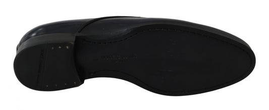 Black car with curved design and lights on front