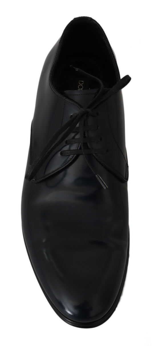 Black dress shoe with laces and a smooth finish