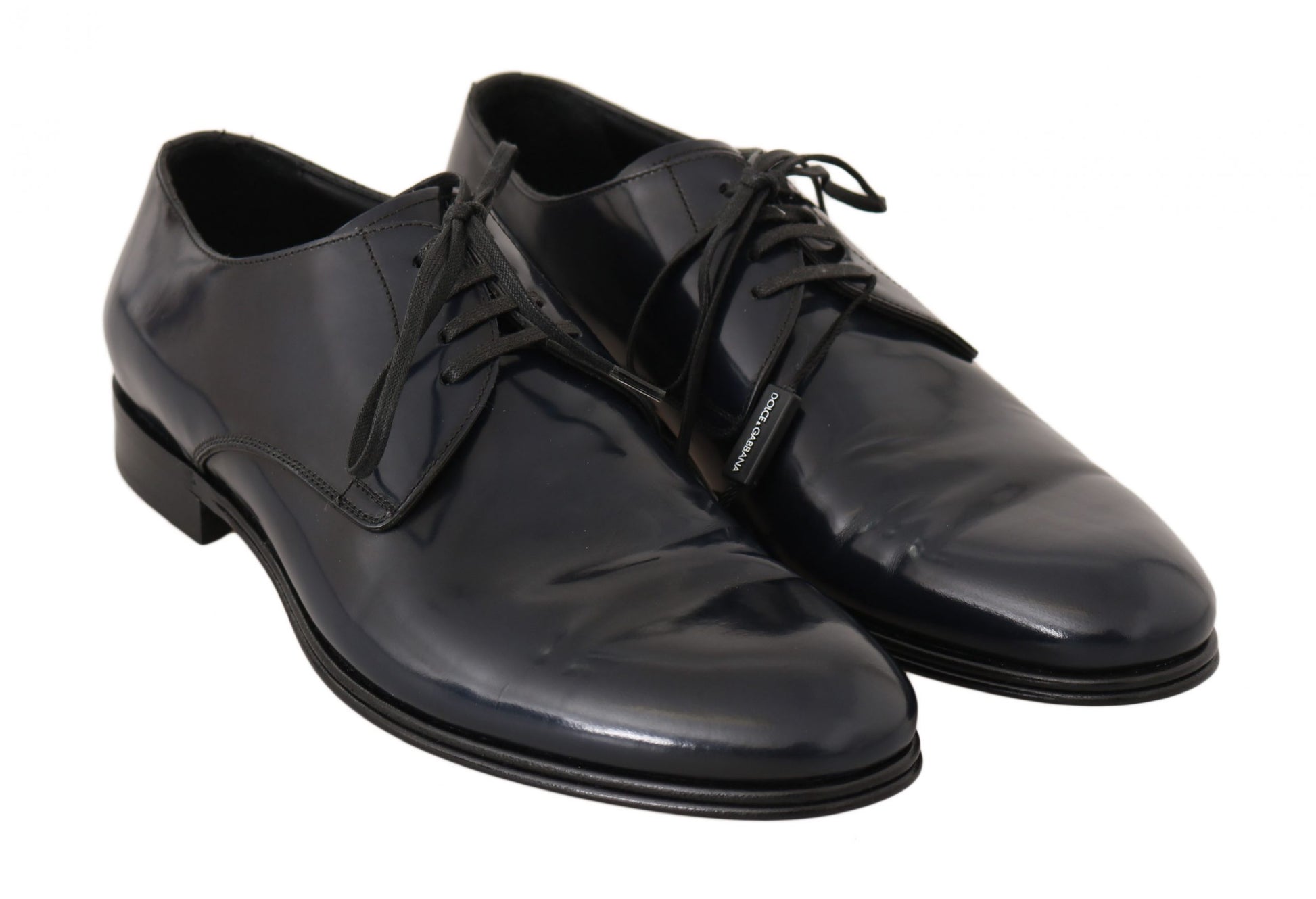 Pair of black patent leather dress shoes with laces and a shiny finish