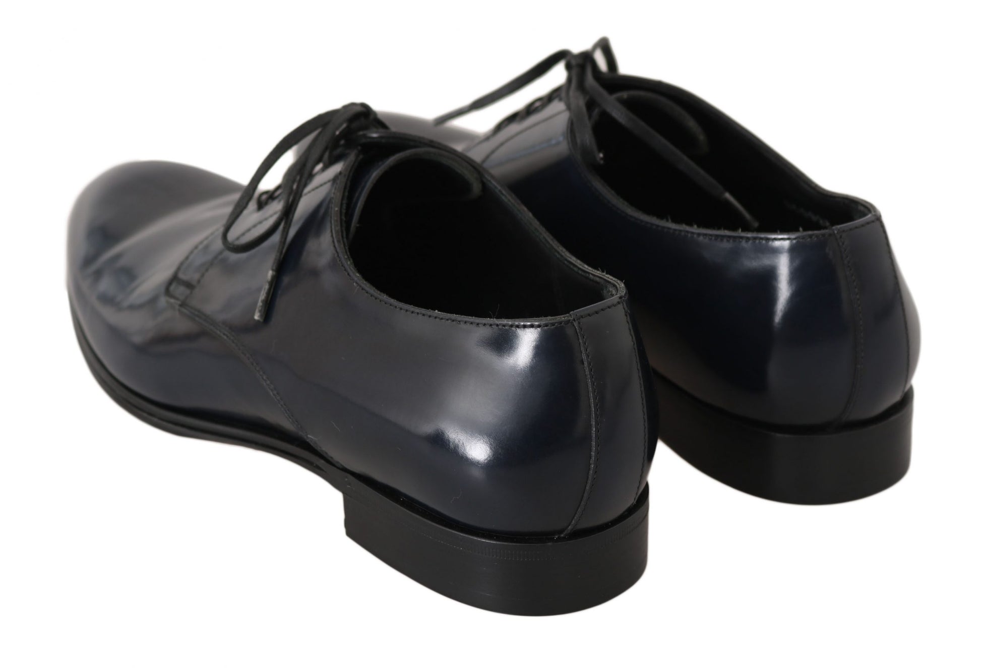 Pair of black leather shoes with laces and a shiny finish