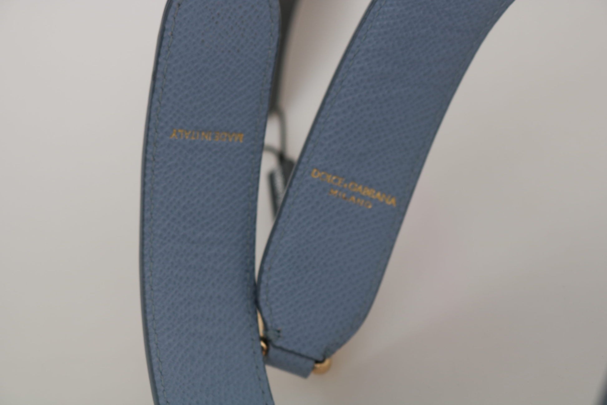 Blue strap with gold buckle