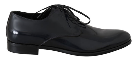 Black dress shoe with laces and a shiny finish