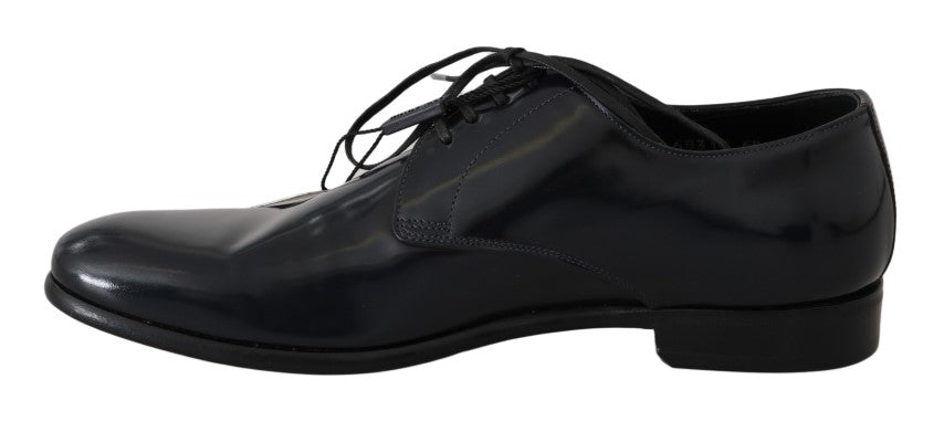 Black dress shoes with laces and a shiny finish