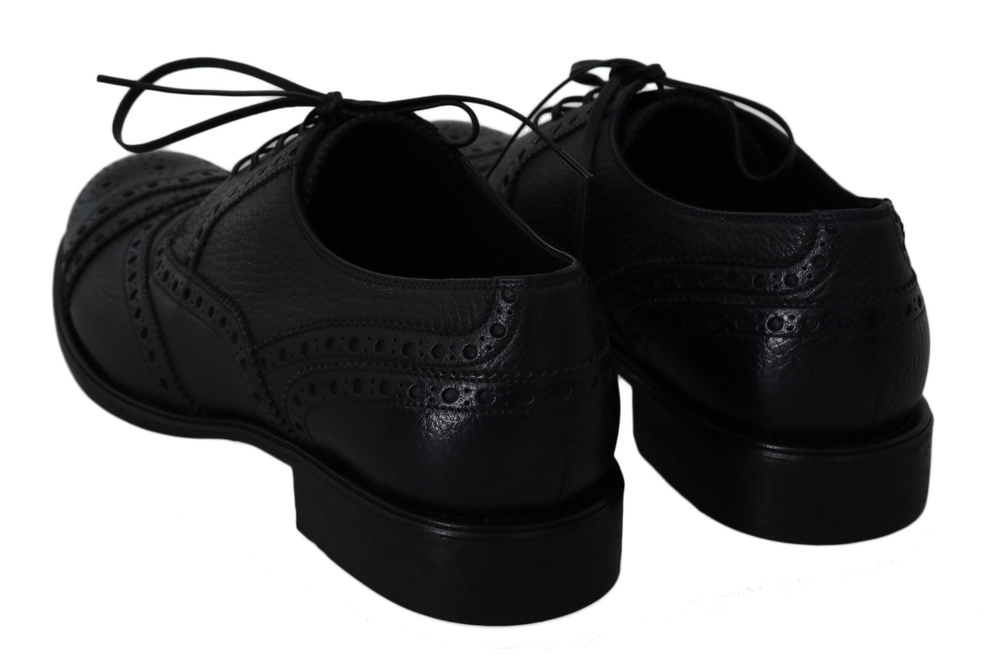 Pair of black dress shoes with laces and a shiny finish