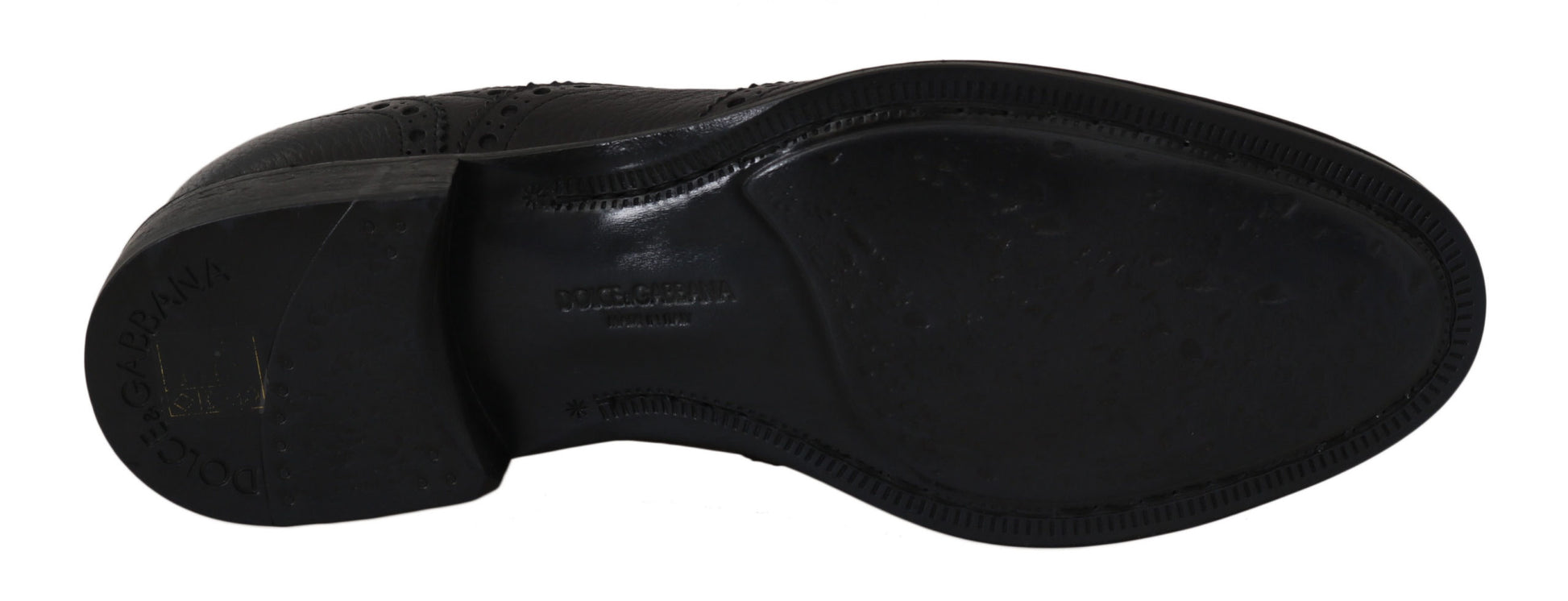 Black rubber tire with white lettering and numbers on side