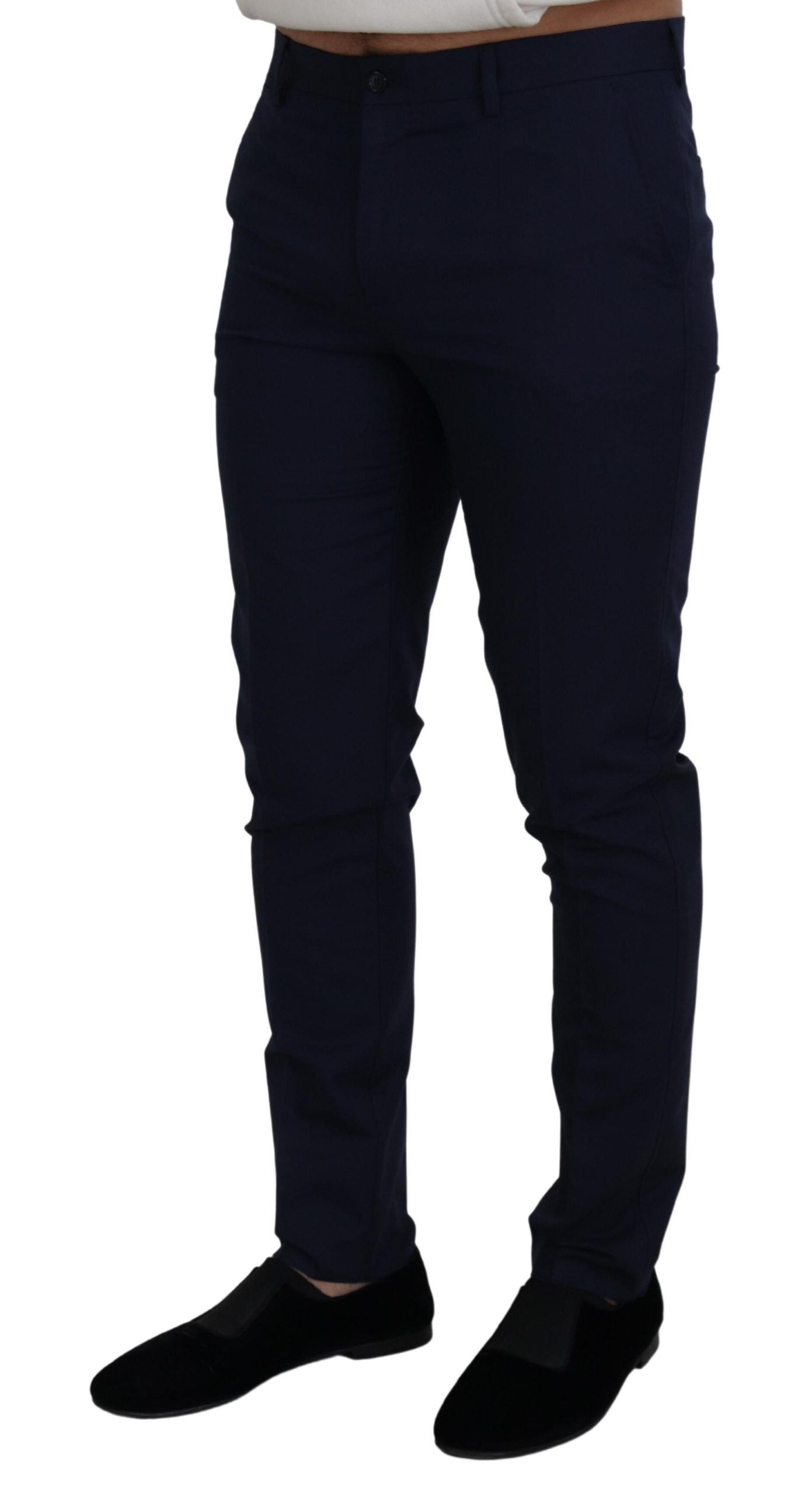 Man wearing dark pants and black shoes