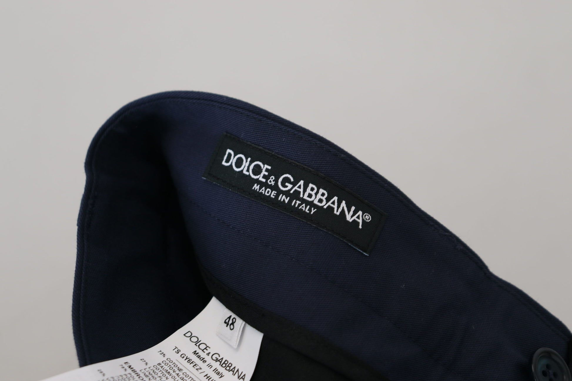 Navy blue cap with white logo on front