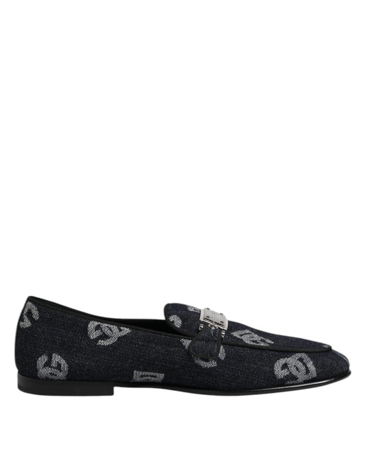 A pair of blue loafers with a logo on the side, featuring a glittery texture and a bow design
