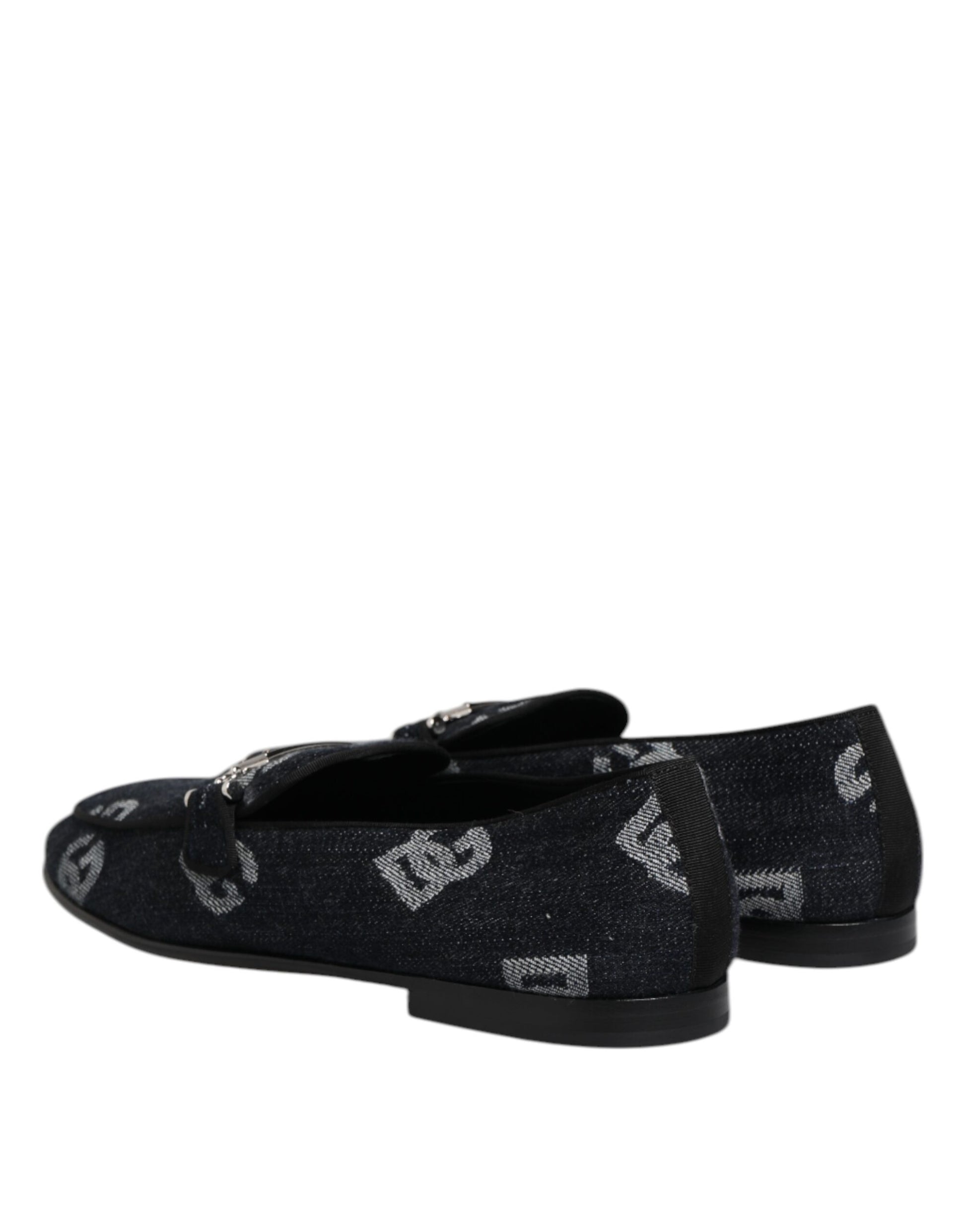 A pair of blue loafers with a logo pattern on the side, featuring a black sole and heel