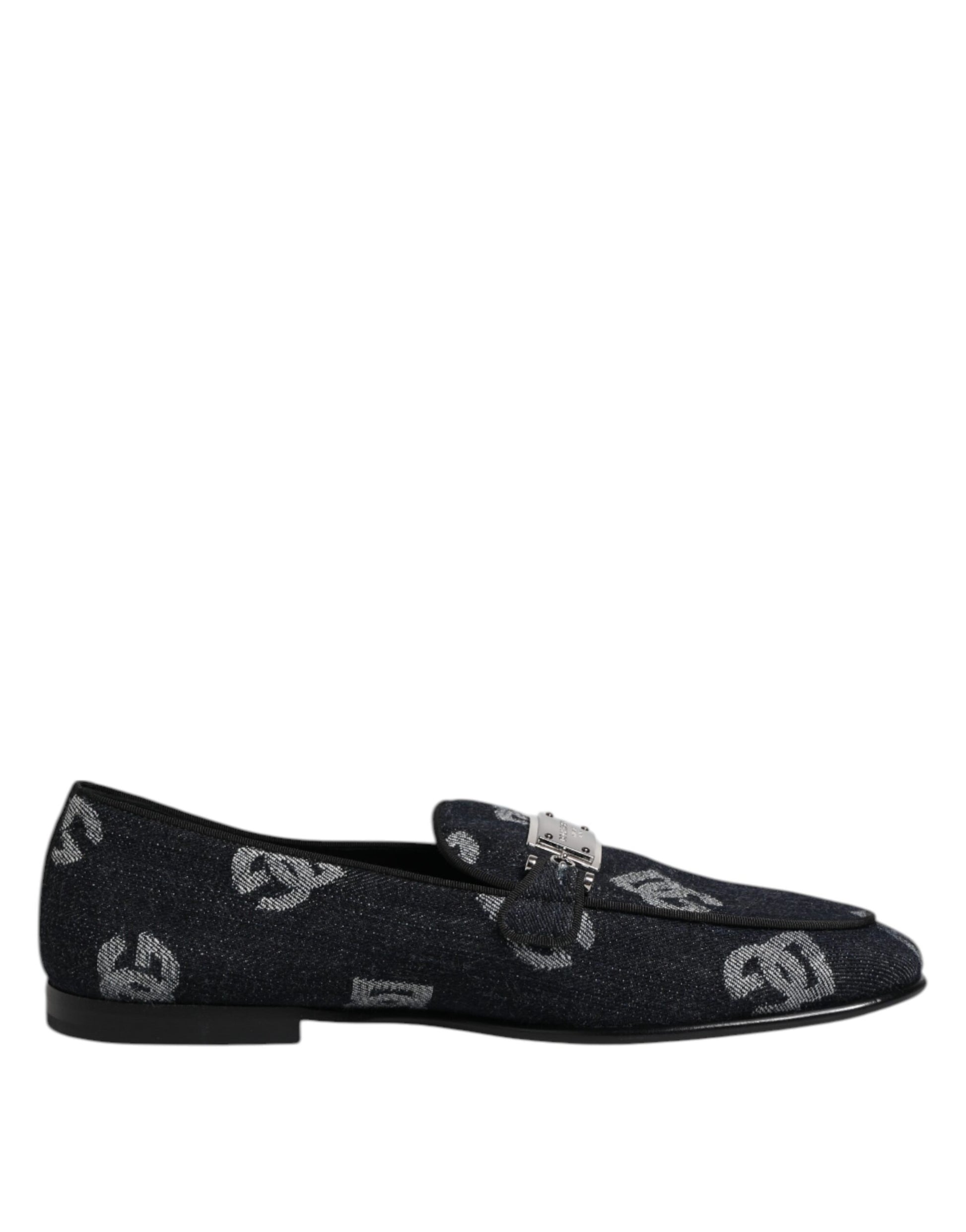 A pair of blue loafers with a logo on the side, featuring a glittery texture and a bow detail