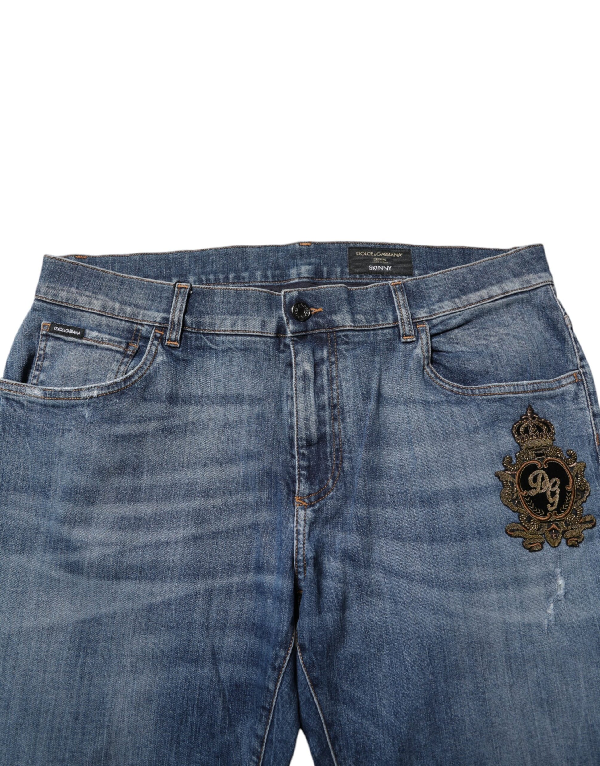 Pair of blue denim jeans with embroidered patch on right leg
