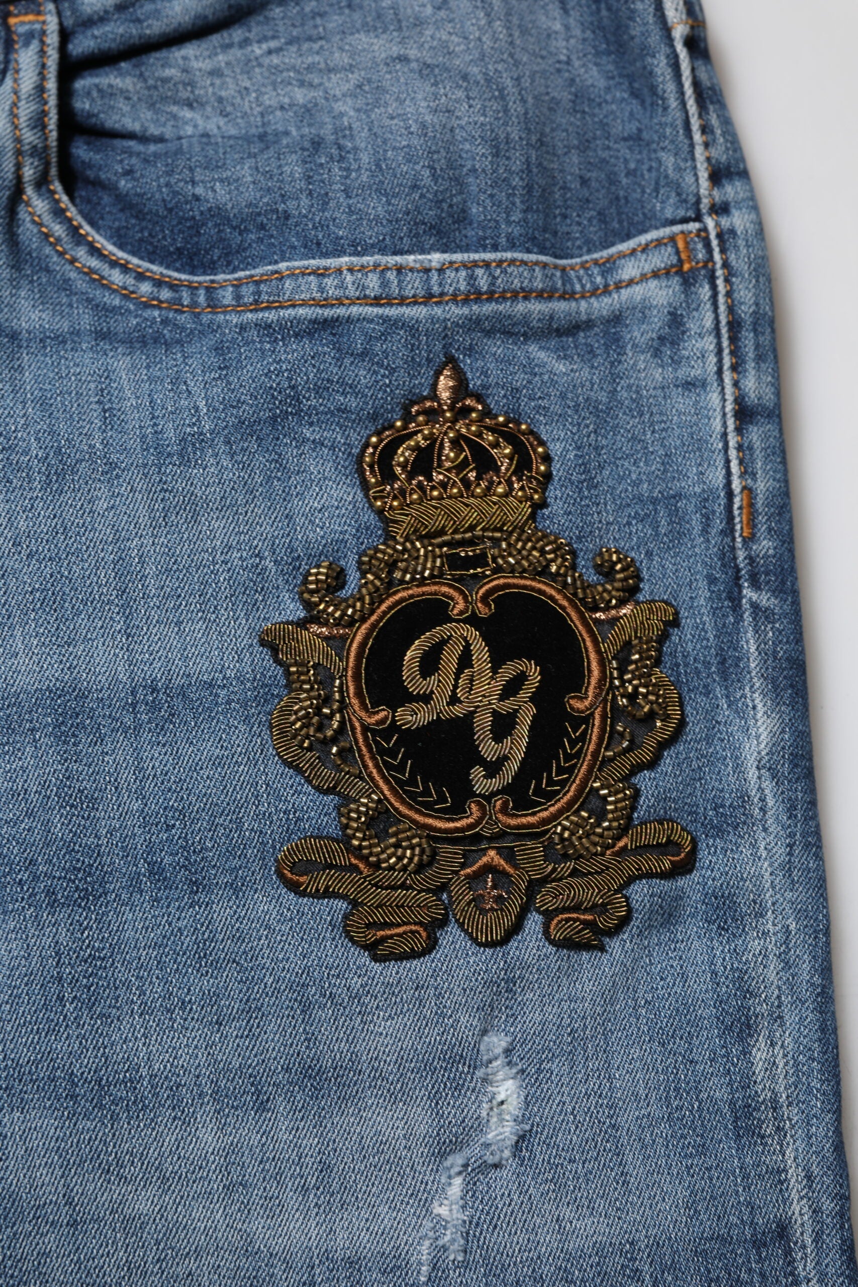 Decorative emblem on denim jeans