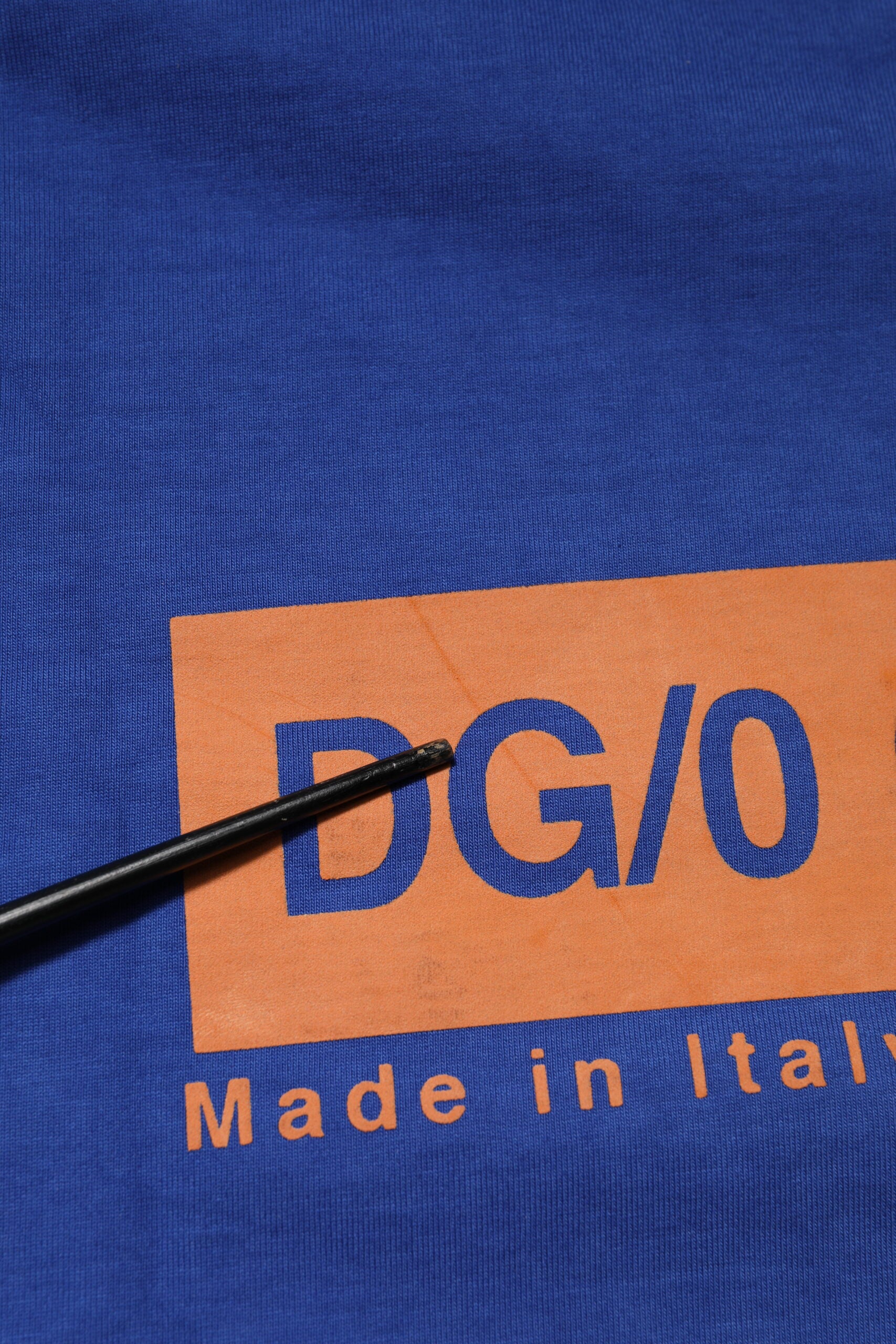 Blue shirt with orange letters