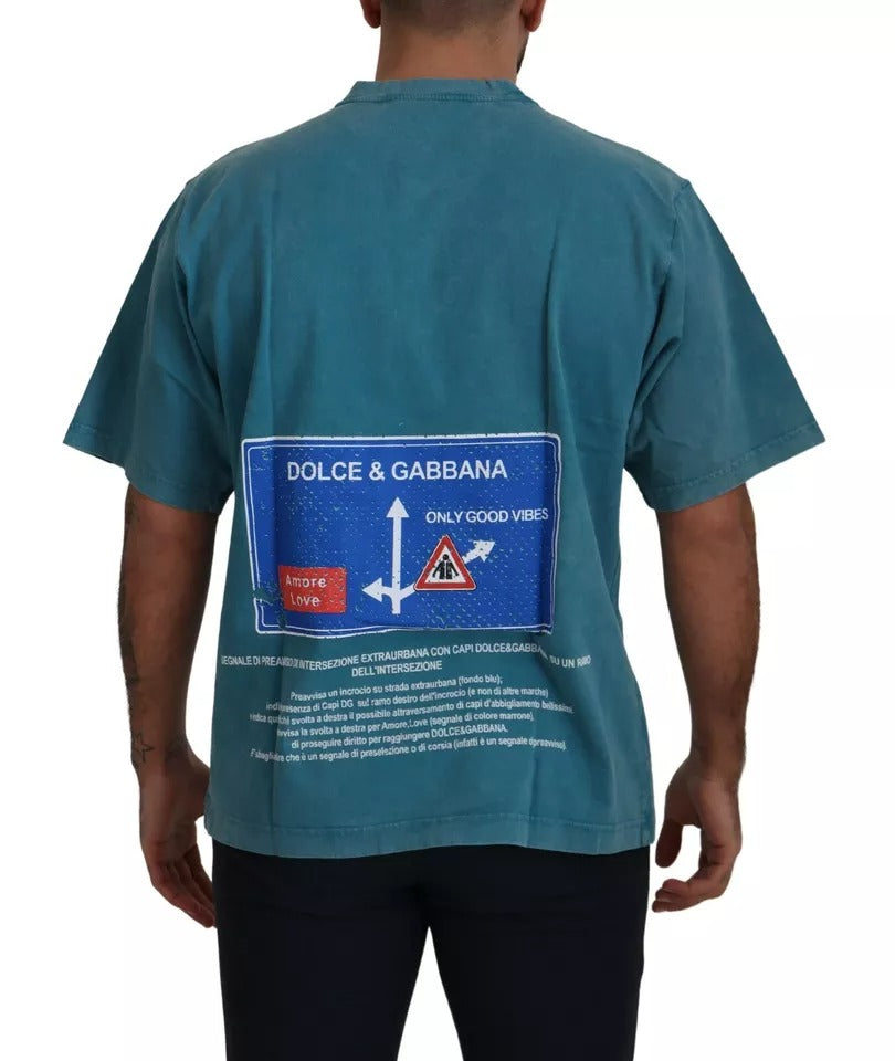 Man wearing blue shirt with sign on back