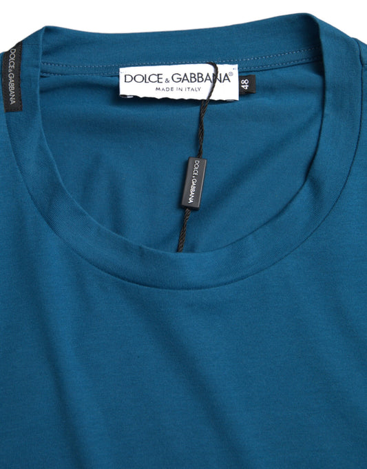 A blue round neck t-shirt with a logo on the front