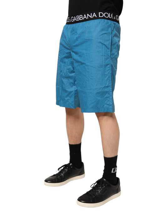 Blue shorts with white logo on waistband