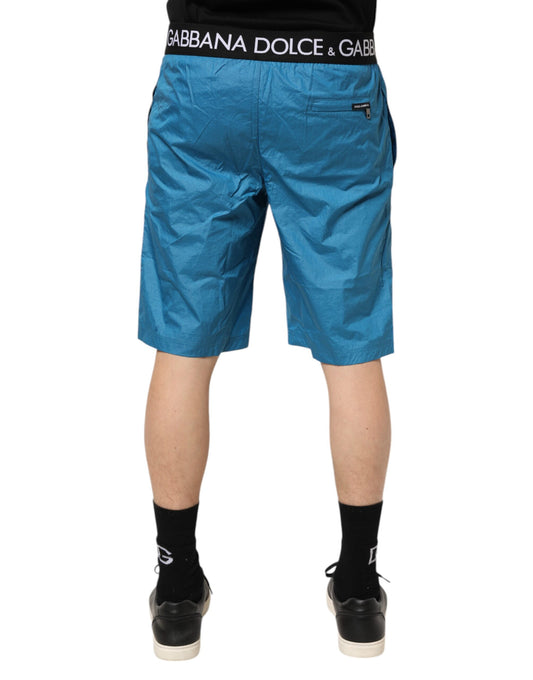 Pair of blue shorts with white logo on waistband
