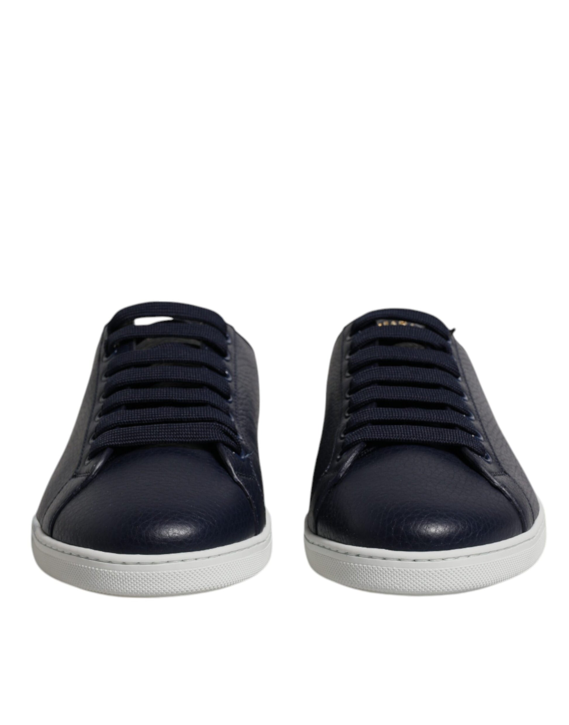 Pair of blue sneakers with white soles and laces