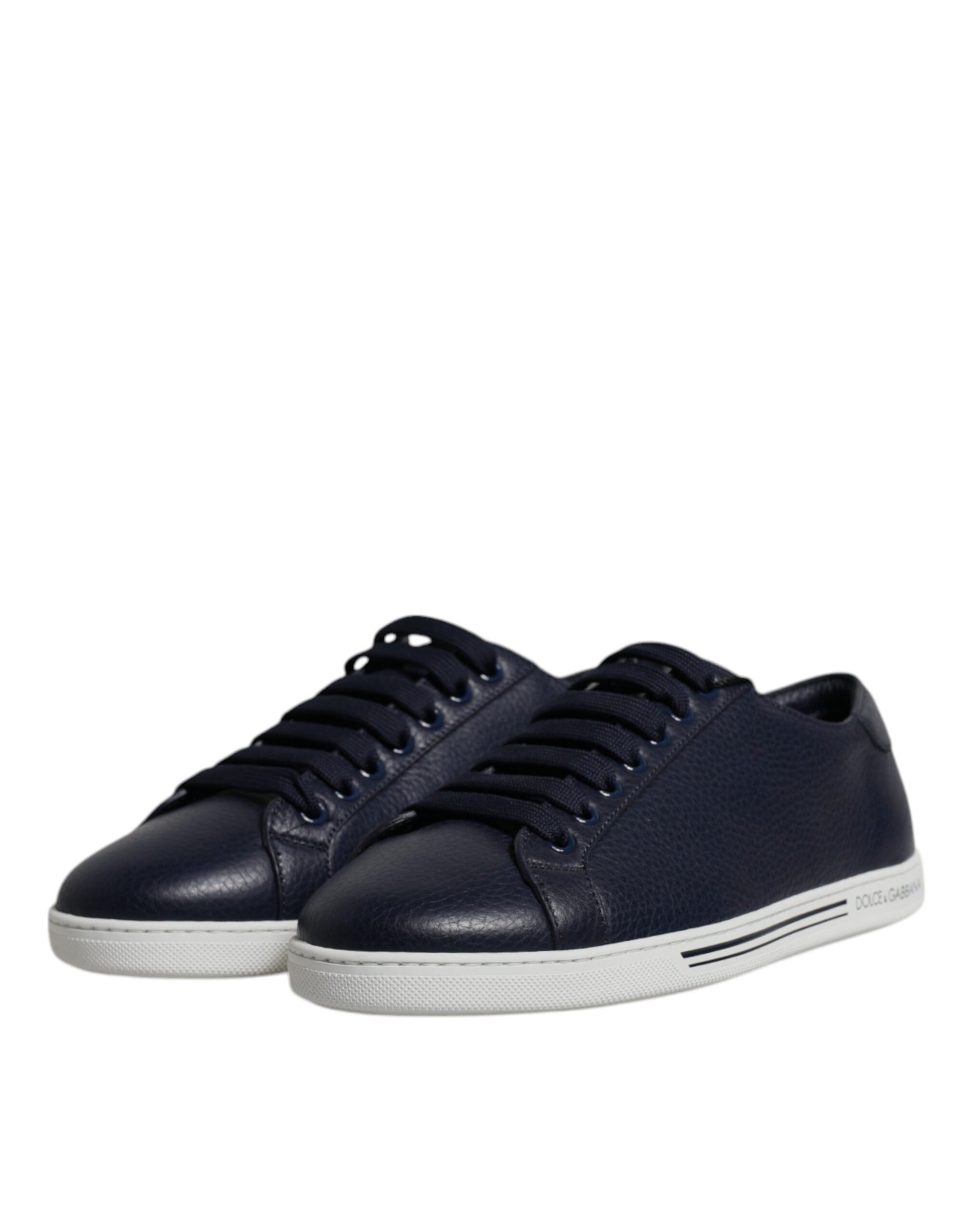 Pair of black sneakers with white soles and laces