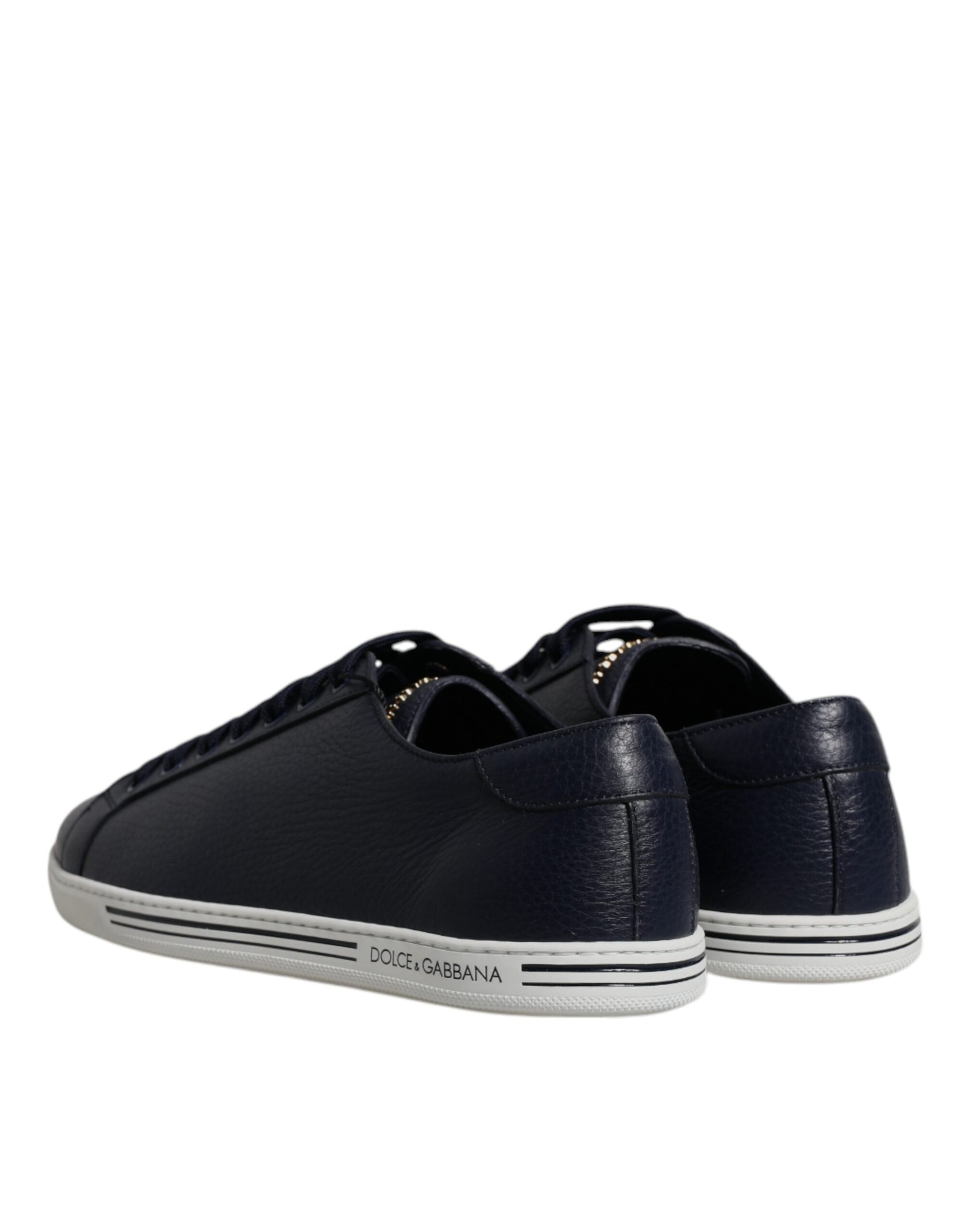 Pair of black sneakers with white sole and laces