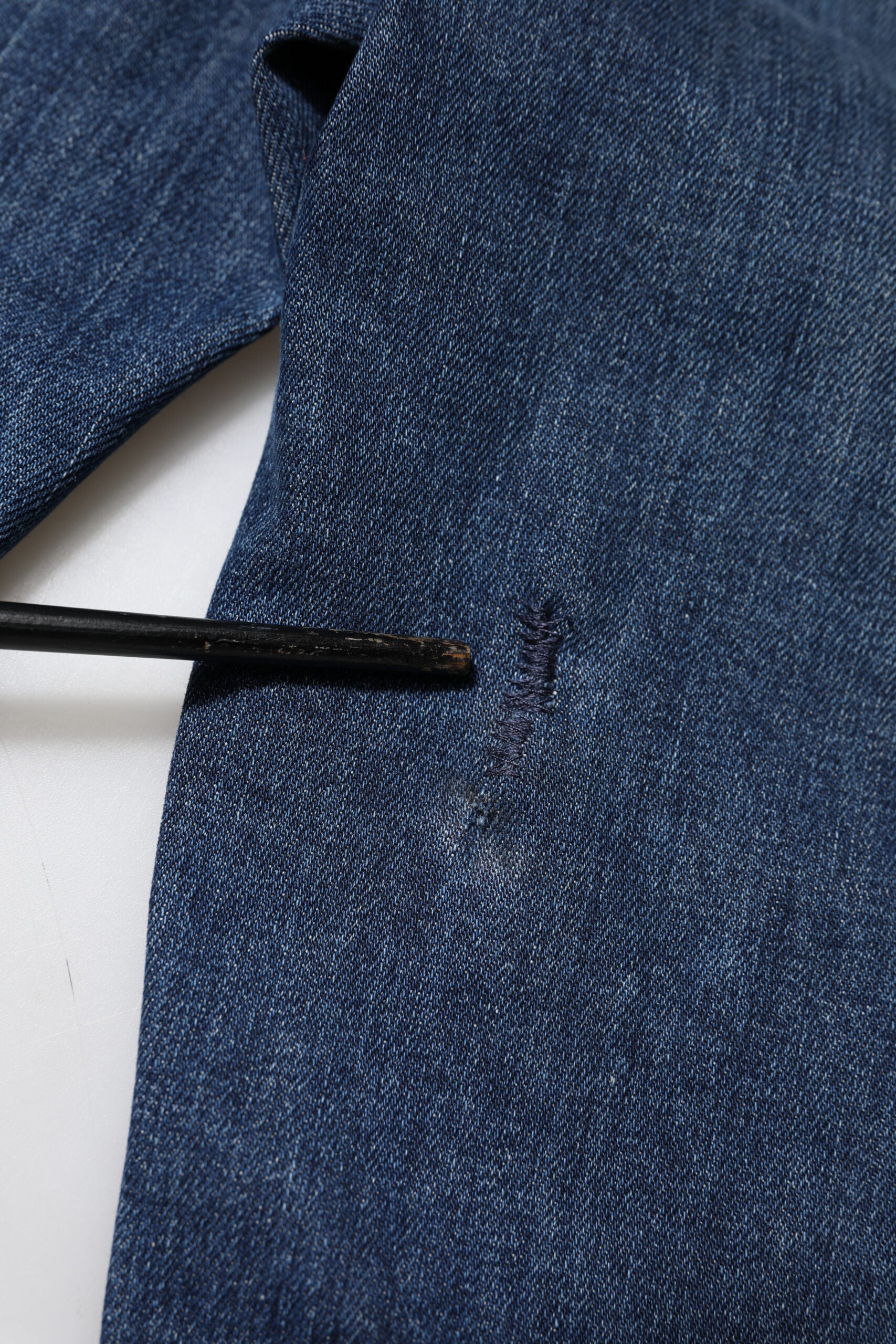 Blue denim jacket with buttonhole