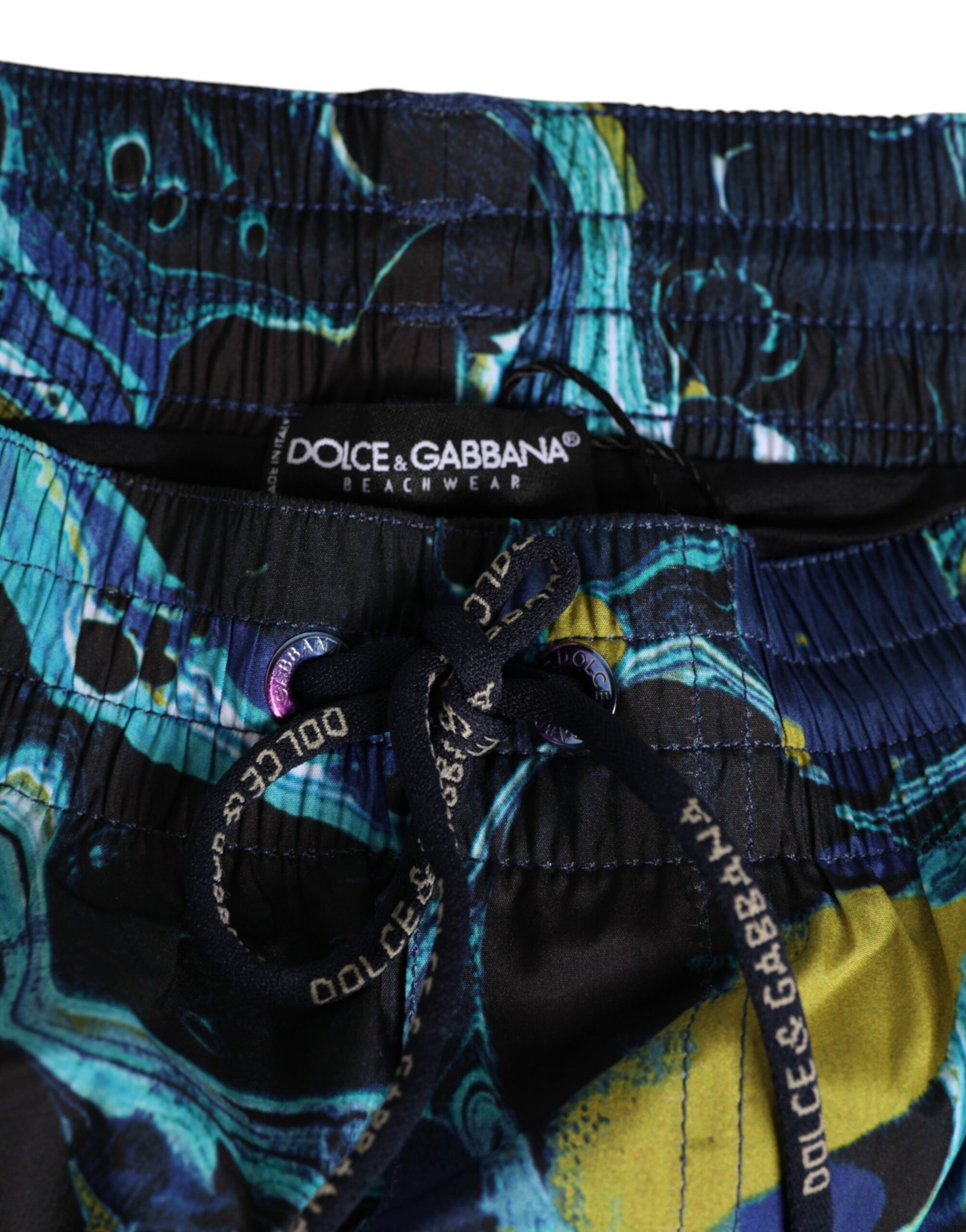 Blue swim trunks with white logo