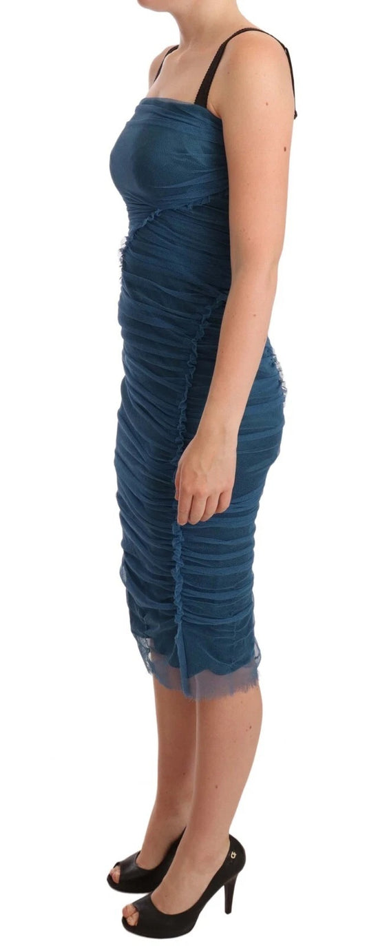 A blue dress with mesh trim and tulle ruffles