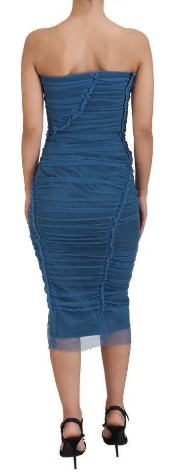A blue dress with mesh trim and ruched tulle detailing
