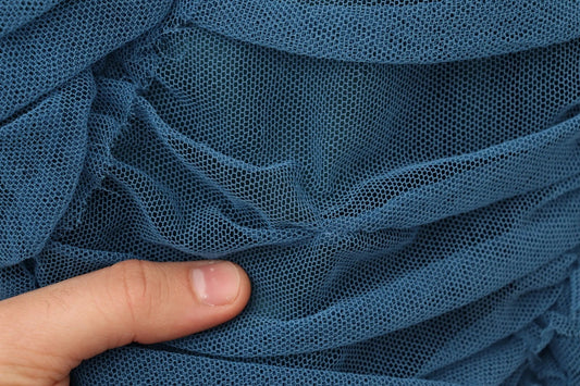 A blue mesh trim ruched tulle sheath dress