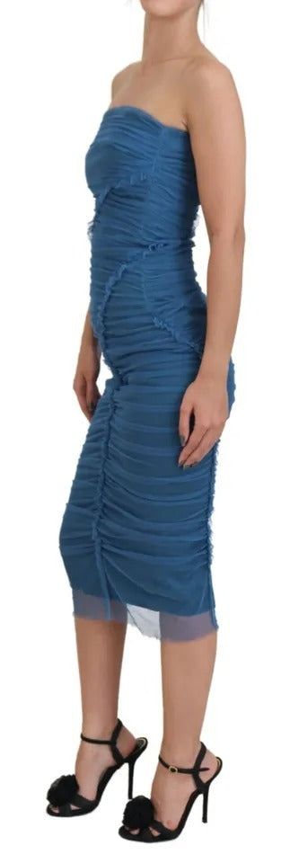 A blue dress with mesh trim and ruched tulle detailing