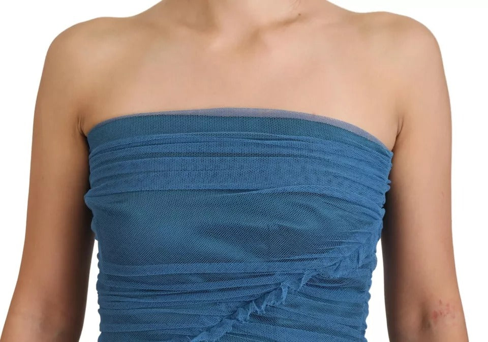 A blue mesh trim ruched tulle sheath dress with a fitted bodice and flared skirt