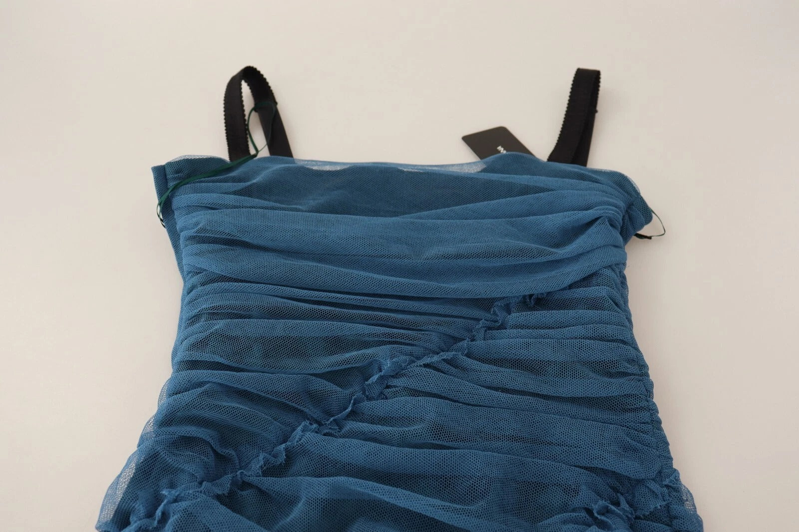 A blue mesh trim ruched tulle sheath dress by Dolce & Gabbana
