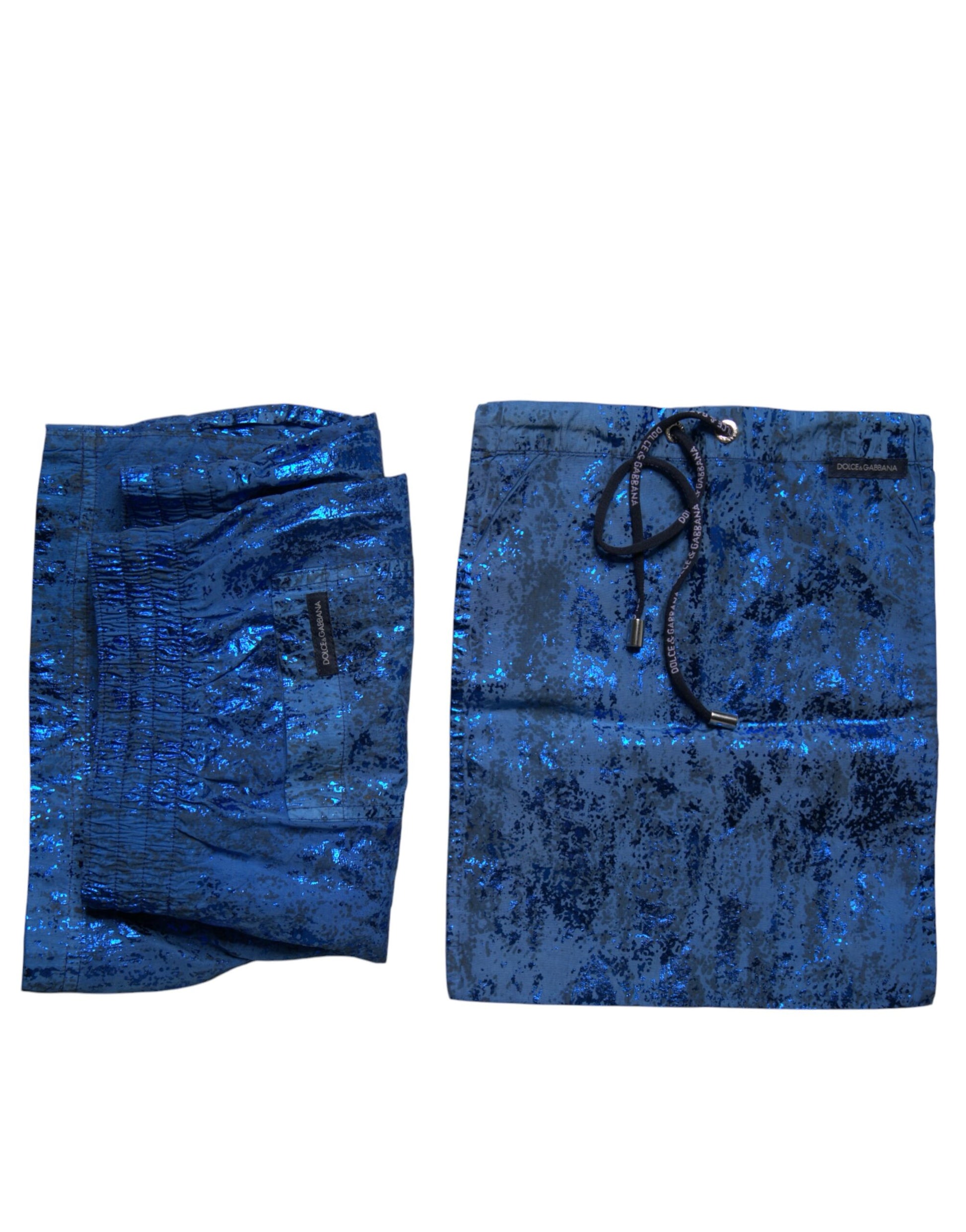 A pair of blue nylon beachwear swim shorts with a glittery texture