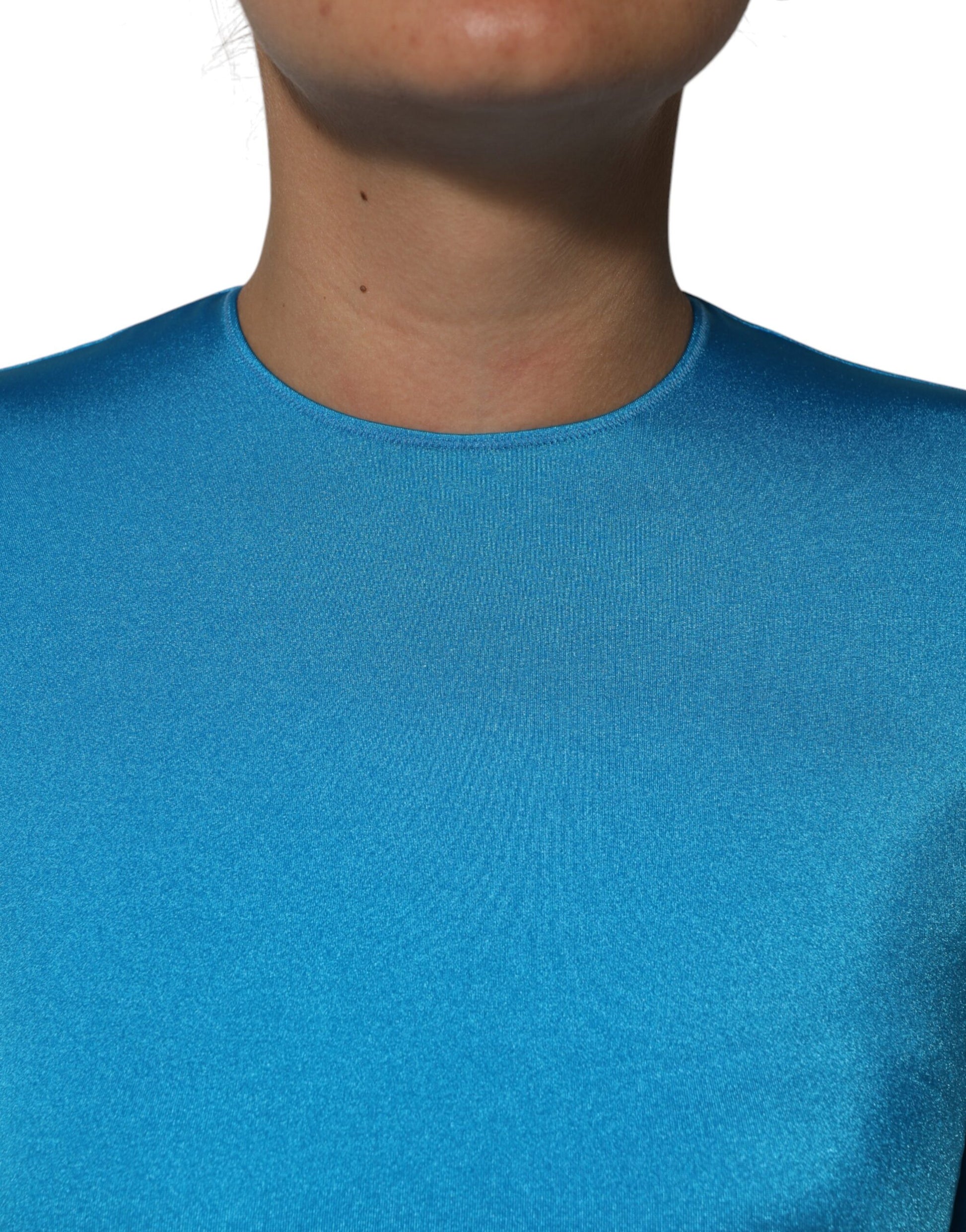 A blue nylon jumpsuit dress with a crew neck