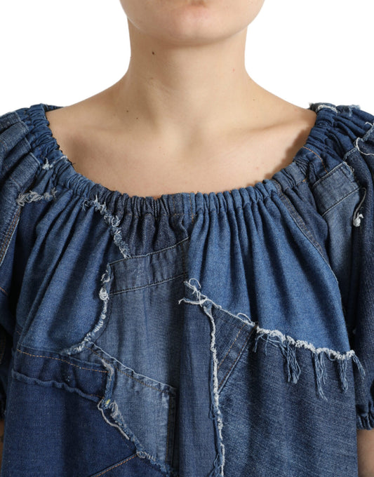Woman wearing denim top with ruffles and distressed areas