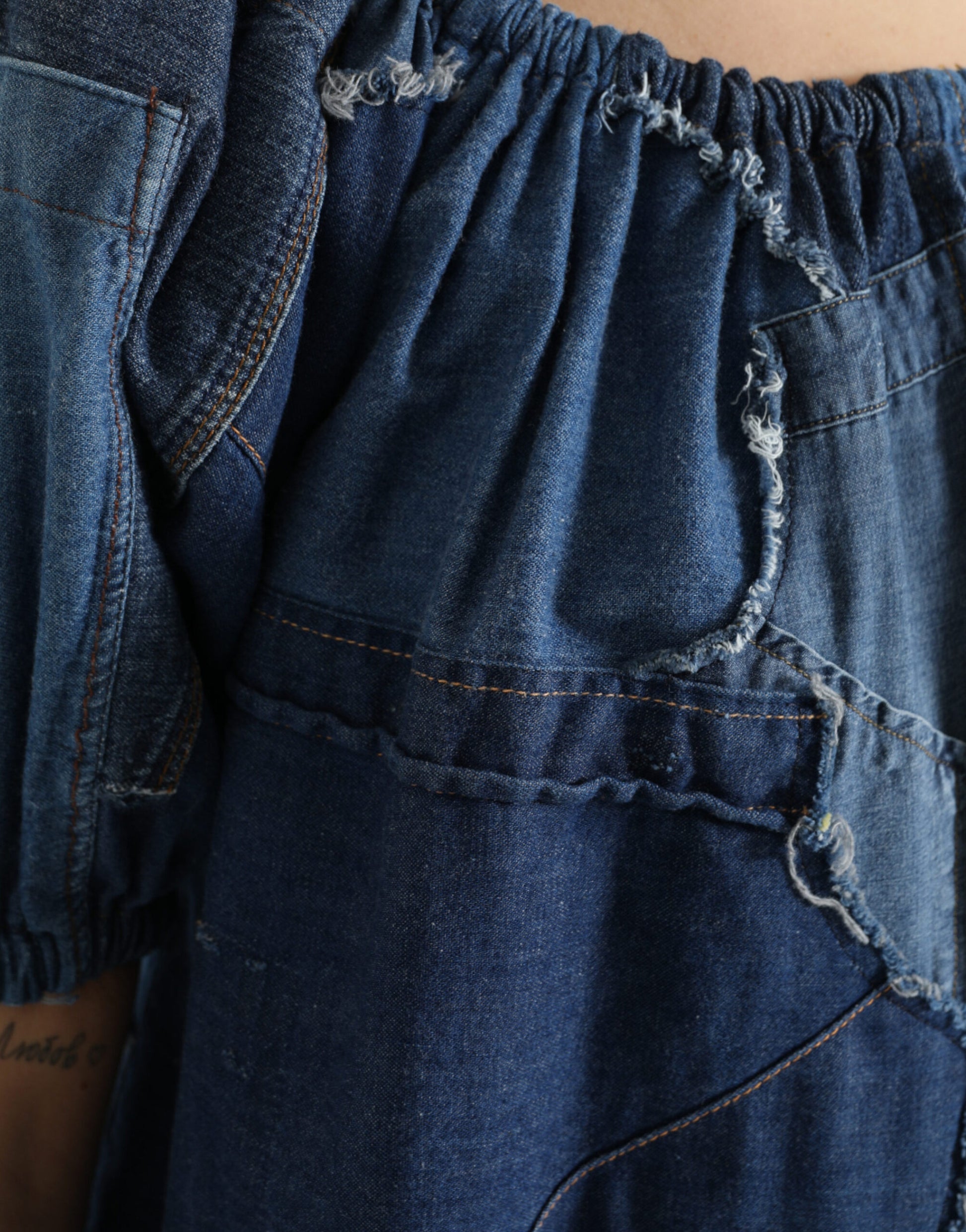 Blue denim jeans with distressed details