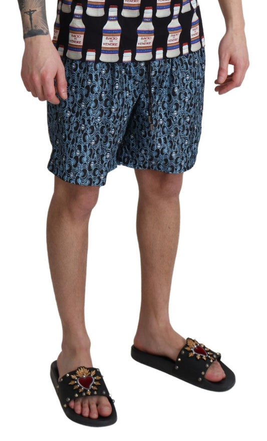 Man wearing patterned shorts and sandals