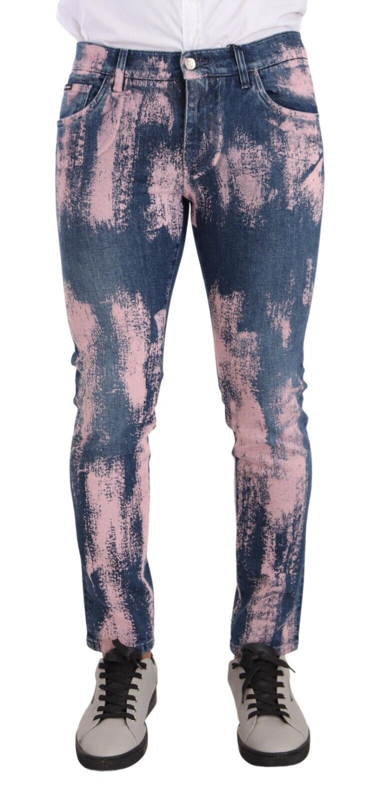 Pair of distressed jeans with pink and blue design