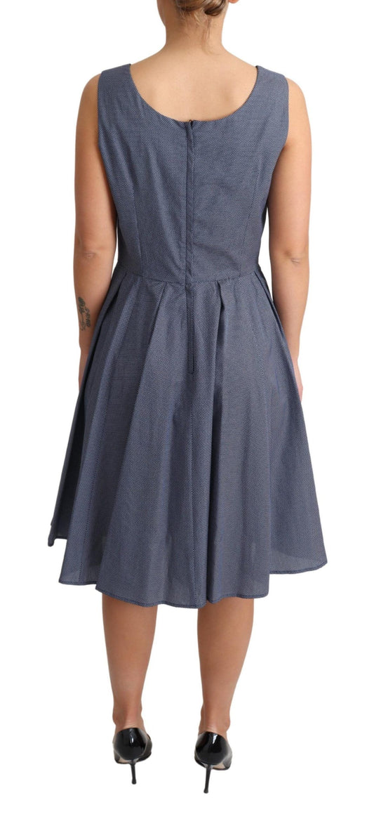 A blue polka dot dress with an A-line silhouette, made of stretch cotton