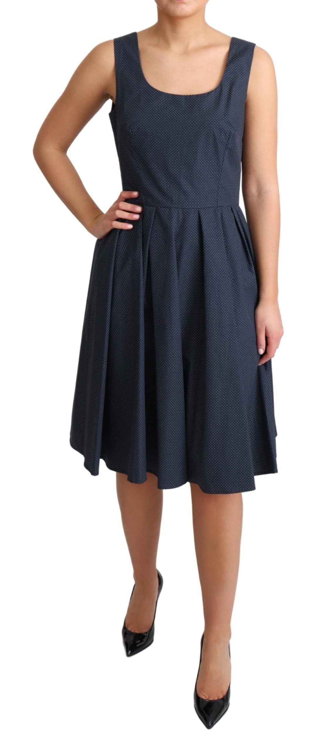 A blue polka dotted cotton dress with an A-line silhouette