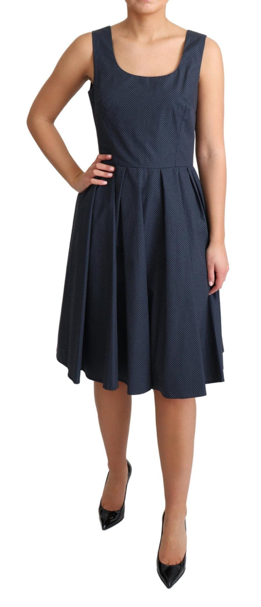A blue polka dotted cotton dress with an A-line silhouette