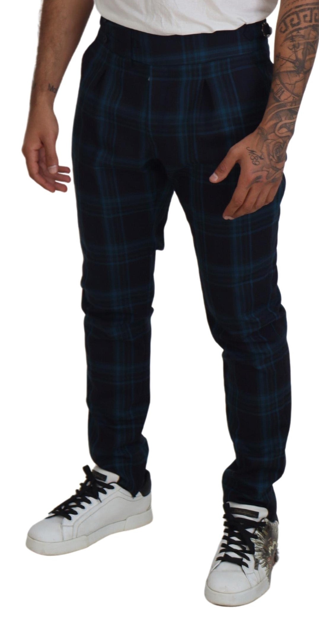 Man wearing plaid pants and sneakers