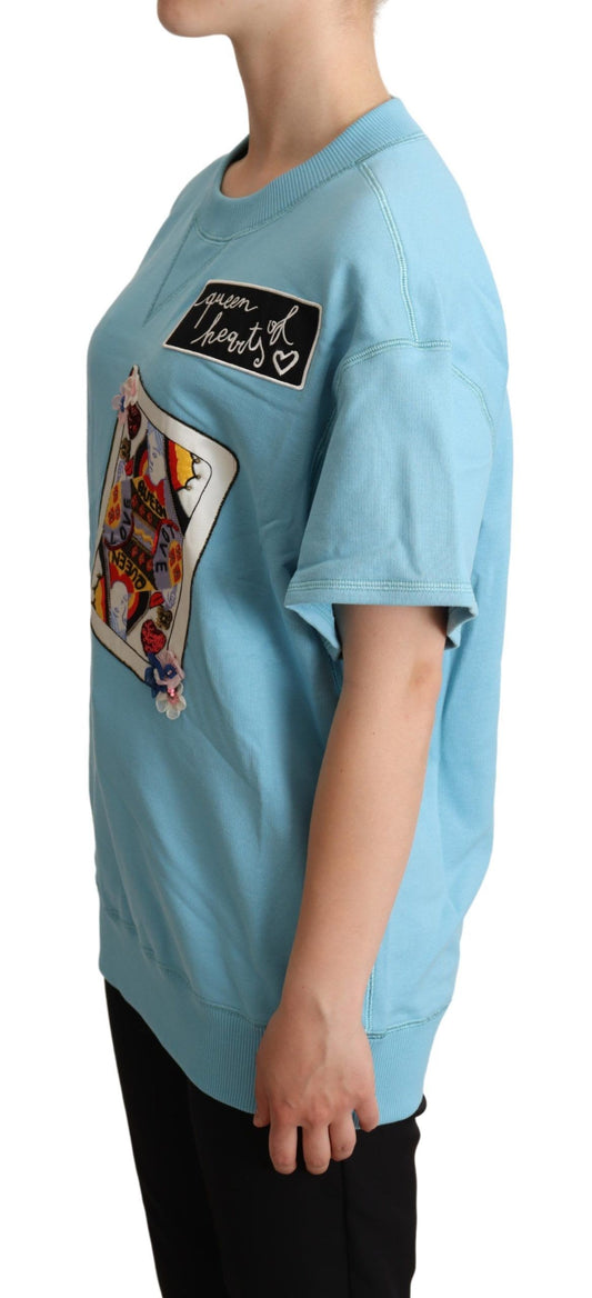 Woman wearing blue t-shirt with graphic design on front