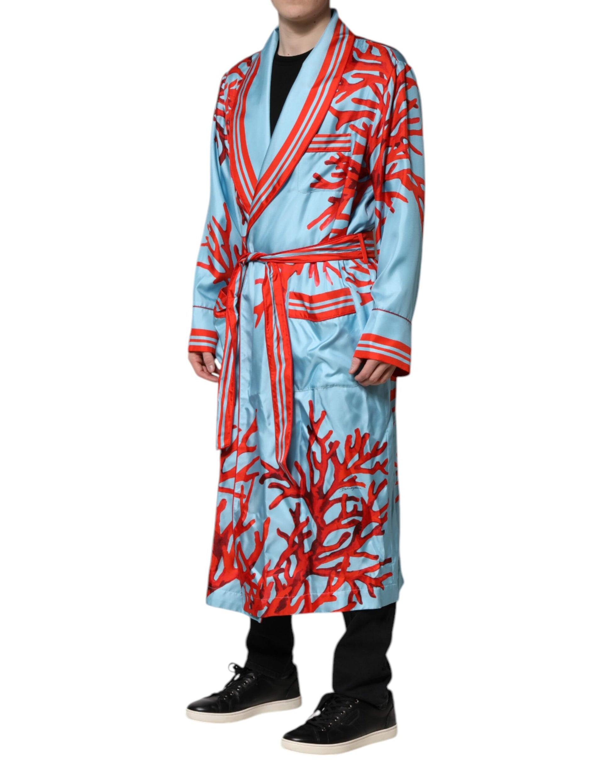Man wearing blue robe with red pattern