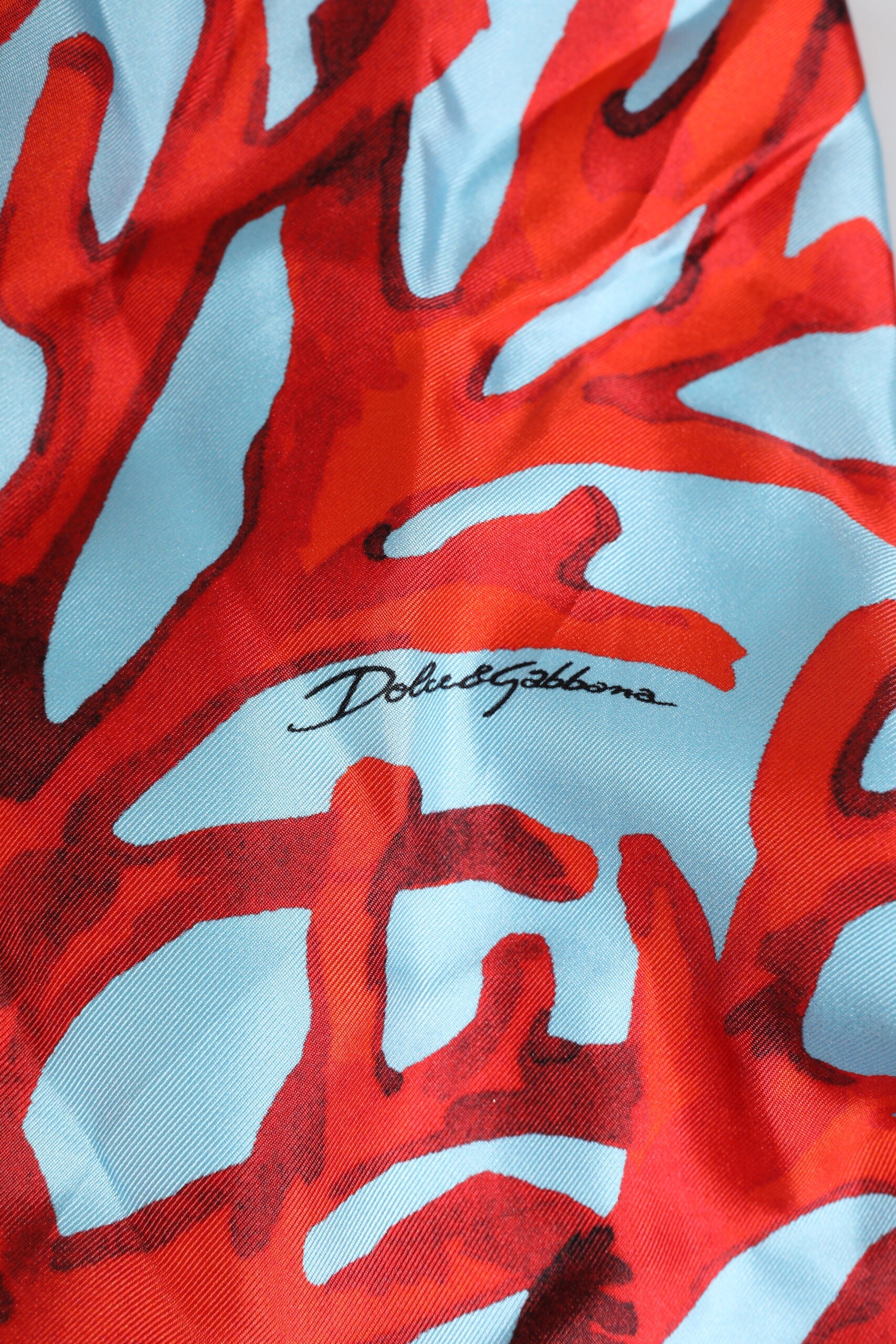 Red and blue fabric with coral design